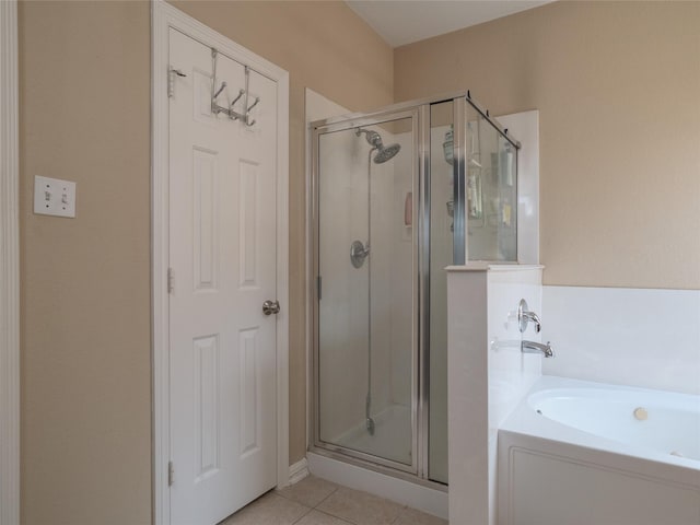19327 Dickson Park Dr, Spring, TX 77373 - full bathroom with a stall shower, a garden tub, and tile patterned floors