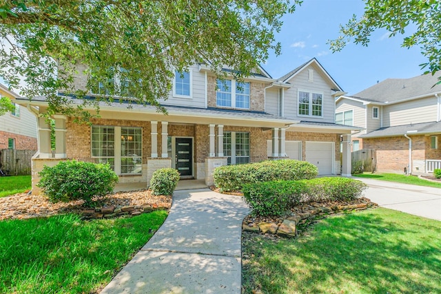 13811 Pepperstone Ln, Houston, TX 77044 - view of front of house with a garage, a porch, concrete driveway, and brick siding