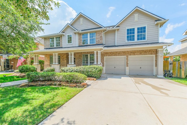 13811 Pepperstone Ln, Houston, TX 77044 - view of front of property featuring a garage, concrete driveway, brick siding, and covered porch
