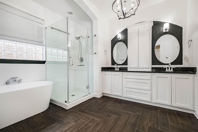 13811 Pepperstone Ln, Houston, TX 77044 - full bathroom featuring a shower stall, double vanity, and a freestanding bath