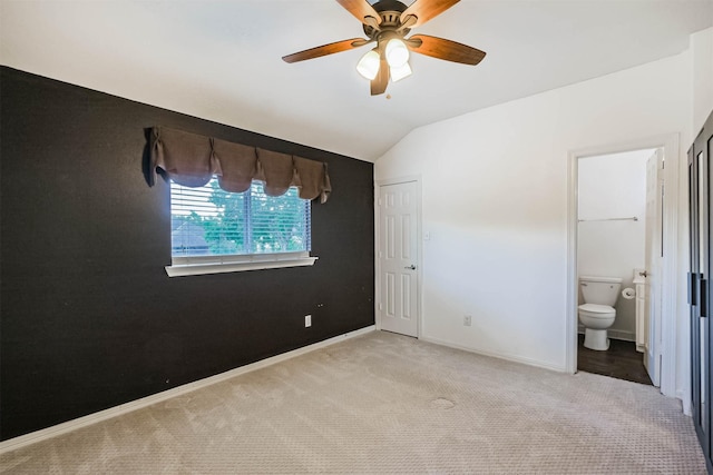13811 Pepperstone Ln, Houston, TX 77044 - unfurnished bedroom with carpet floors, lofted ceiling, ensuite bath, and ceiling fan