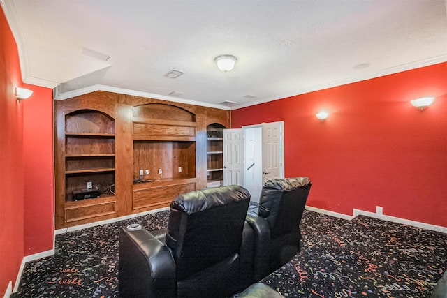 13811 Pepperstone Ln, Houston, TX 77044 - home theater with carpet floors, built in shelves, crown molding, and a textured ceiling