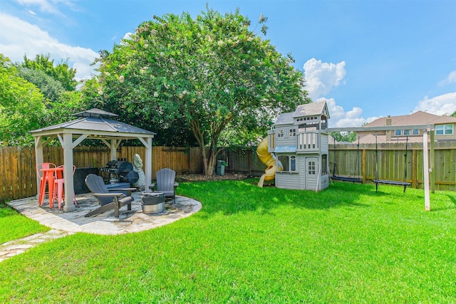 13811 Pepperstone Ln, Houston, TX 77044 - fenced backyard with a playground, an outdoor fire pit, a gazebo, and a patio
