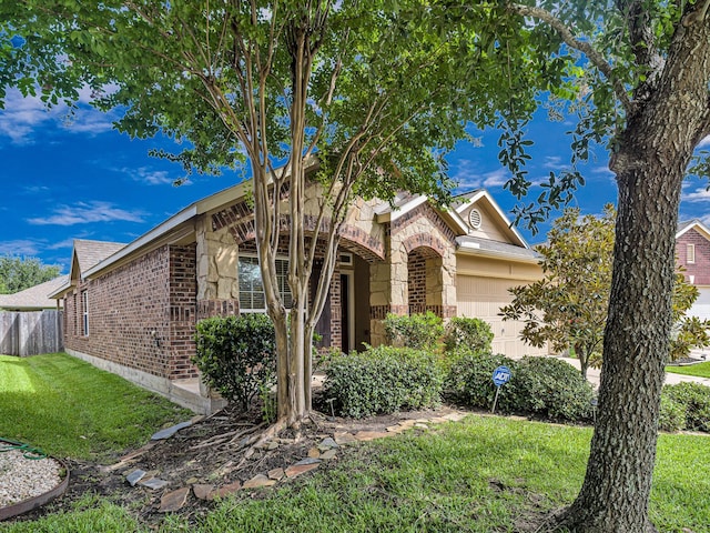 10163 Rose Willow Ln, Brookshire, TX 77423 - view of front of property with brick siding, a garage, and stone siding