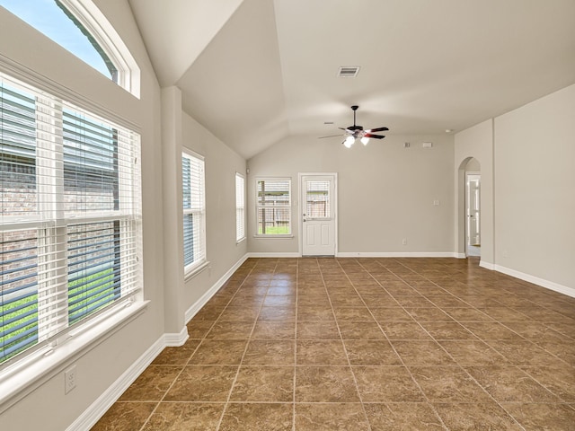 10163 Rose Willow Ln, Brookshire, TX 77423 - unfurnished living room featuring healthy amount of natural light, ceiling fan, lofted ceiling, and arched walkways