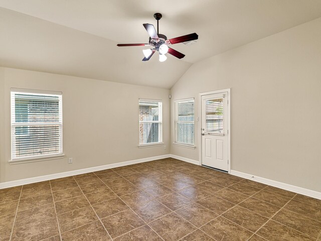10163 Rose Willow Ln, Brookshire, TX 77423 - tiled empty room with healthy amount of natural light, lofted ceiling, and ceiling fan