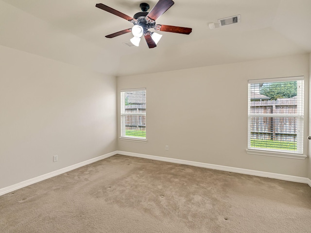 10163 Rose Willow Ln, Brookshire, TX 77423 - carpeted empty room featuring plenty of natural light, lofted ceiling, and ceiling fan