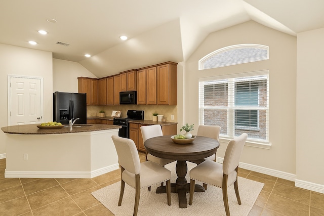 10163 Rose Willow Ln, Brookshire, TX 77423 - dining space featuring lofted ceiling, healthy amount of natural light, and light tile patterned flooring