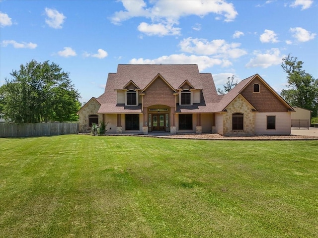 1273 County Road 201a, Angleton, TX 77515 - view of front of property featuring stone siding, a shingled roof, and french doors