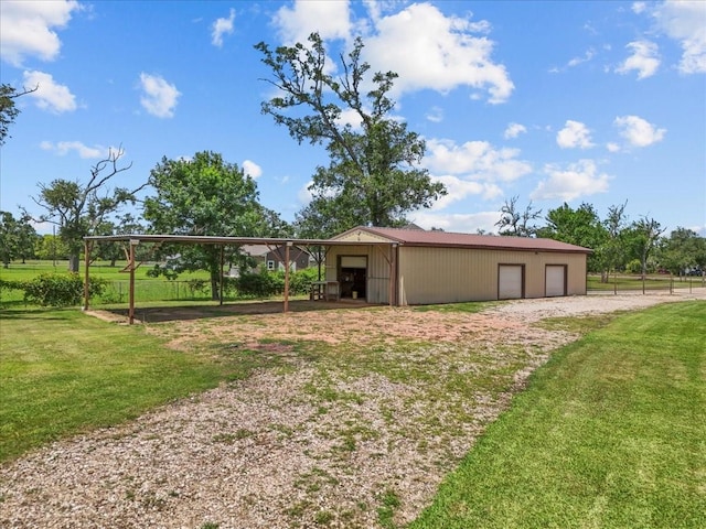 1273 County Road 201a, Angleton, TX 77515 - view of pole building with a lawn and driveway