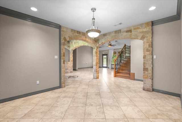 1273 County Road 201a, Angleton, TX 77515 - unfurnished room featuring arched walkways, stairway, crown molding, ceiling fan, and recessed lighting