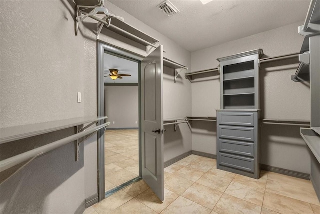 1273 County Road 201a, Angleton, TX 77515 - spacious closet with light tile patterned floors and ceiling fan