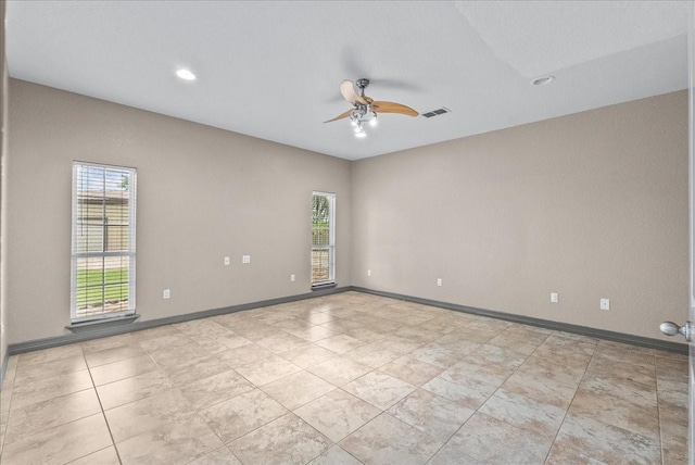 1273 County Road 201a, Angleton, TX 77515 - tiled empty room with a ceiling fan and recessed lighting