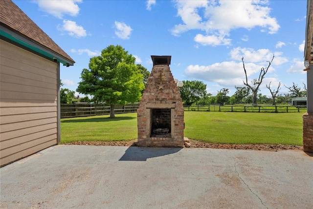 1273 County Road 201a, Angleton, TX 77515 - view of patio / terrace with an outdoor stone fireplace