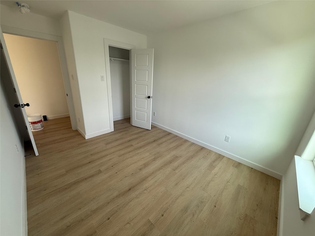 8601 Wileyvale Rd, Houston, TX 77016 - unfurnished bedroom with light wood-style flooring and a closet