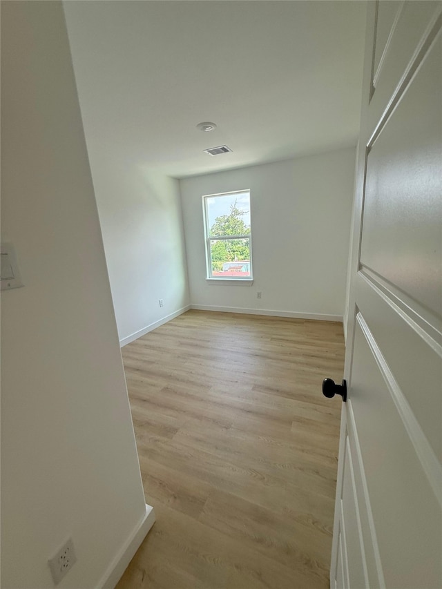 8601 Wileyvale Rd, Houston, TX 77016 - empty room with baseboards and light wood finished floors