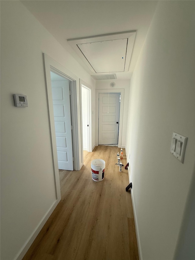 8601 Wileyvale Rd, Houston, TX 77016 - hallway with attic access and wood finished floors
