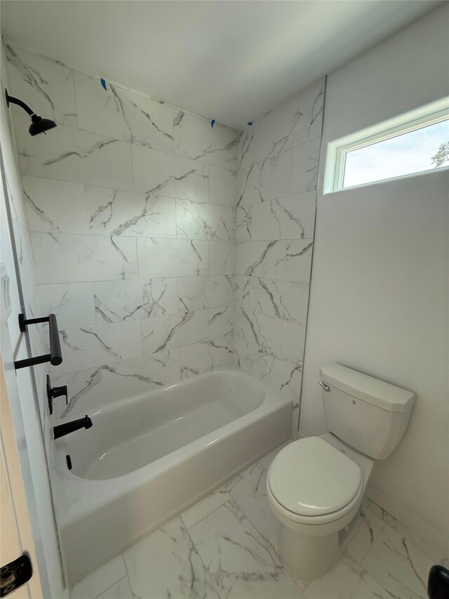 8601 Wileyvale Rd, Houston, TX 77016 - full bath with marble look tile flooring and shower / bathtub combination