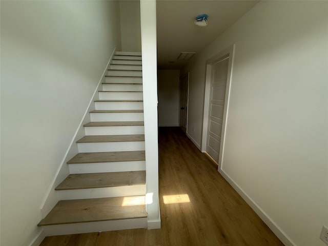 8601 Wileyvale Rd, Houston, TX 77016 - stairway featuring wood finished floors