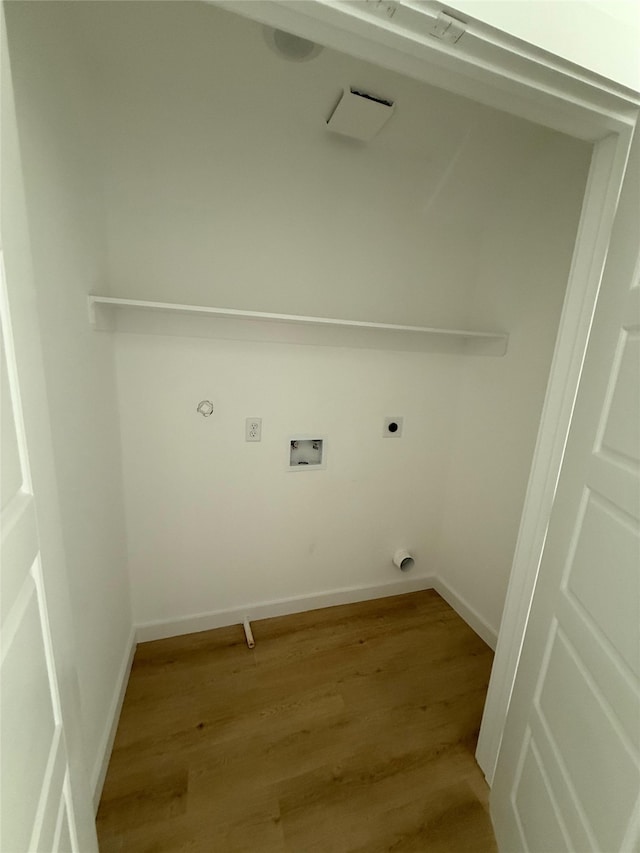 8601 Wileyvale Rd, Houston, TX 77016 - laundry room featuring hookup for an electric dryer, light wood-style floors, and hookup for a washing machine