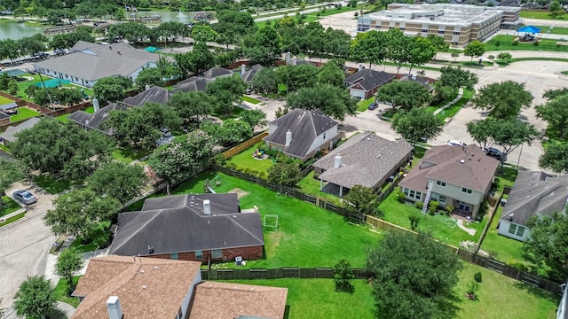12005 Green Falls Dr, Pearland, TX 77584 - aerial overview of property's location with nearby suburban area and a nearby body of water