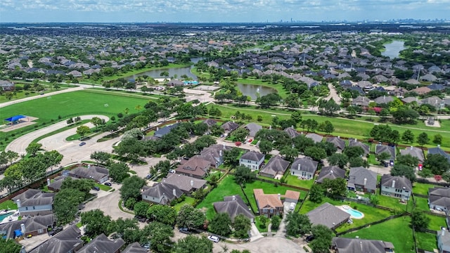 12005 Green Falls Dr, Pearland, TX 77584 - aerial view of property and surrounding area featuring a nearby body of water and nearby suburban area