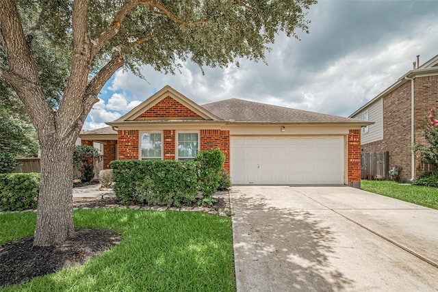 12005 Green Falls Dr, Pearland, TX 77584 - view of front of home featuring brick siding, an attached garage, and driveway