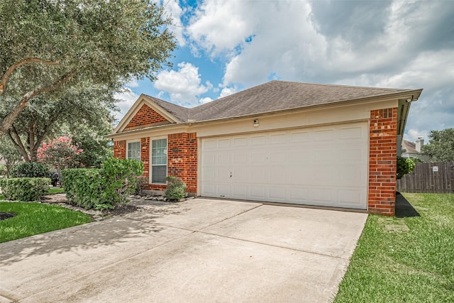 12005 Green Falls Dr, Pearland, TX 77584 - view of front facade featuring brick siding, concrete driveway, an attached garage, and roof with shingles