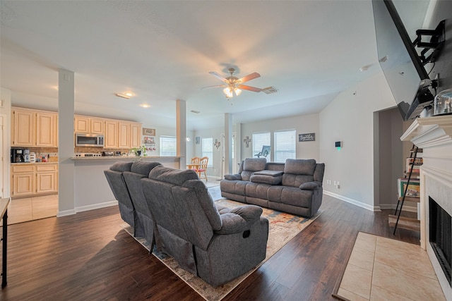 12005 Green Falls Dr, Pearland, TX 77584 - living area featuring dark wood-style floors, a ceiling fan, a fireplace with flush hearth, and recessed lighting