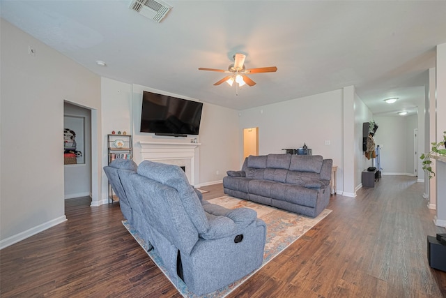 12005 Green Falls Dr, Pearland, TX 77584 - living area featuring a ceiling fan, wood finished floors, and a fireplace