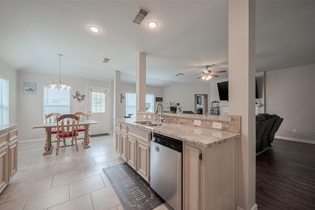 12005 Green Falls Dr, Pearland, TX 77584 - kitchen with stainless steel dishwasher, open floor plan, a ceiling fan, light stone counters, and recessed lighting