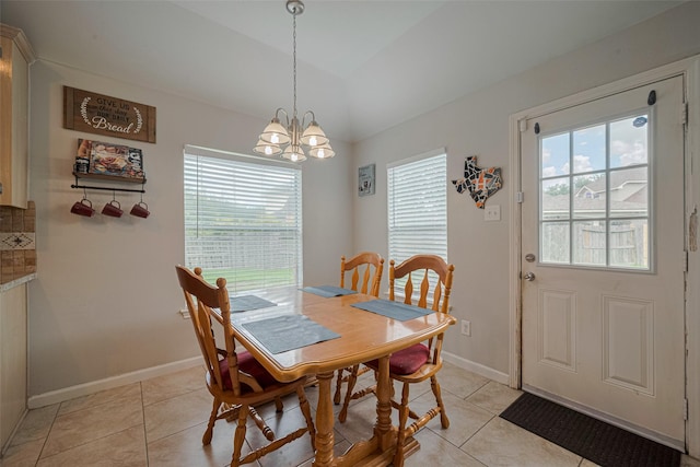 12005 Green Falls Dr, Pearland, TX 77584 - dining room featuring healthy amount of natural light, light tile patterned floors, a chandelier, and vaulted ceiling