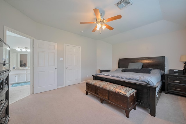 12005 Green Falls Dr, Pearland, TX 77584 - bedroom with light colored carpet, ensuite bath, lofted ceiling, and ceiling fan