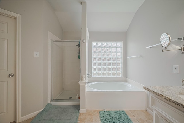 12005 Green Falls Dr, Pearland, TX 77584 - full bathroom featuring a stall shower, a bath, vanity, lofted ceiling, and tile patterned floors