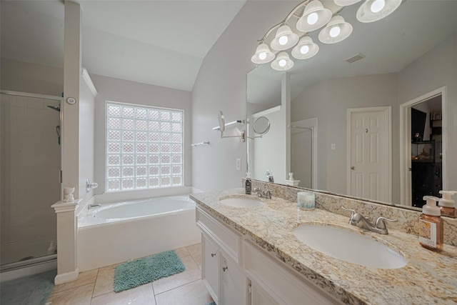 12005 Green Falls Dr, Pearland, TX 77584 - bathroom featuring a stall shower, a bath, double vanity, lofted ceiling, and tile patterned flooring