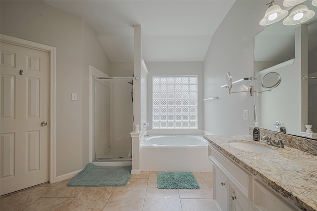 12005 Green Falls Dr, Pearland, TX 77584 - full bathroom with lofted ceiling, a stall shower, vanity, a bath, and tile patterned flooring