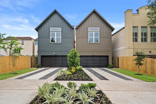 4403 Feagan, Houston, TX 77007 - view of front of property with board and batten siding, driveway, and an attached garage