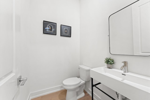 4403 Feagan, Houston, TX 77007 - bathroom featuring toilet and wood finished floors