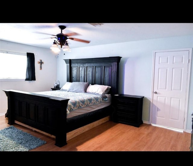 324 E Hunting Tower Run, Montgomery, TX 77316 - bedroom with light wood-style flooring and ceiling fan