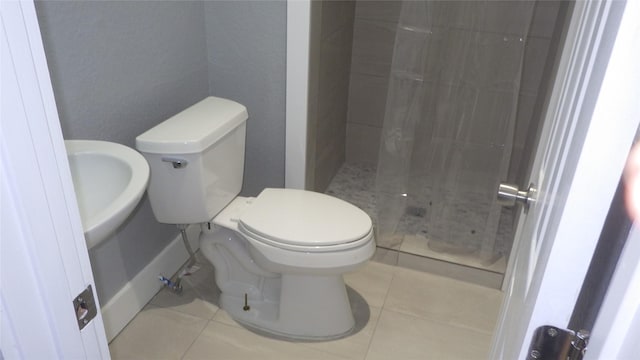 232 Birch St, Lake Jackson, TX 77566 - bathroom with tile patterned floors and tiled shower