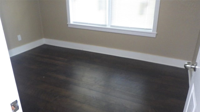 232 Birch St, Lake Jackson, TX 77566 - empty room with dark wood-style flooring