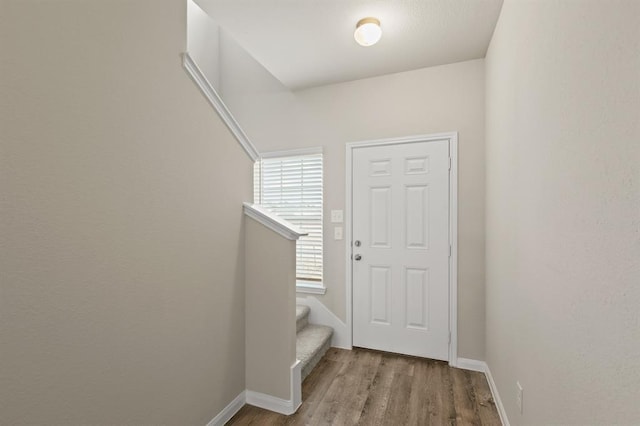 2580 Westslope Dr, Conroe, TX 77384 - foyer featuring wood finished floors and stairway