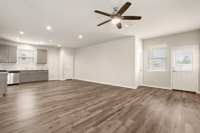 2580 Westslope Dr, Conroe, TX 77384 - unfurnished living room with wood finished floors, recessed lighting, and a ceiling fan