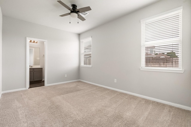 2580 Westslope Dr, Conroe, TX 77384 - unfurnished bedroom featuring carpet flooring, connected bathroom, and a ceiling fan