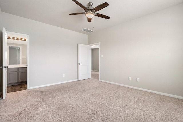 2580 Westslope Dr, Conroe, TX 77384 - unfurnished bedroom featuring carpet floors, connected bathroom, and a ceiling fan