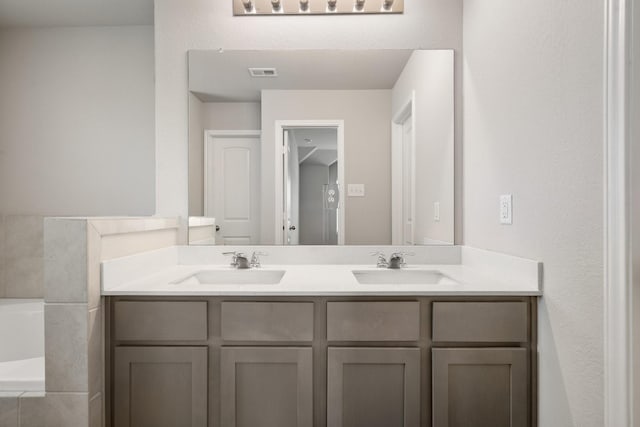 2580 Westslope Dr, Conroe, TX 77384 - bathroom with double vanity and a garden tub