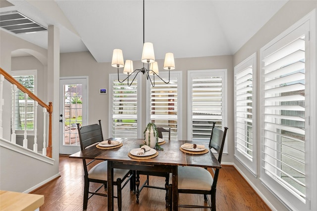 14427 Wickhurst Pl, Cypress, TX 77429 - dining area featuring wood finished floors, stairway, a chandelier, and lofted ceiling