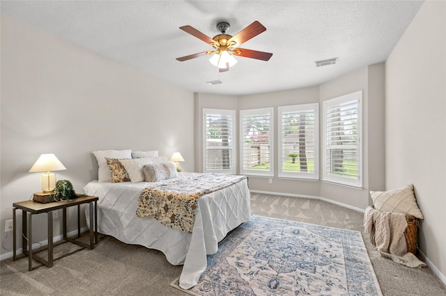 14427 Wickhurst Pl, Cypress, TX 77429 - bedroom with carpet, a ceiling fan, and a textured ceiling