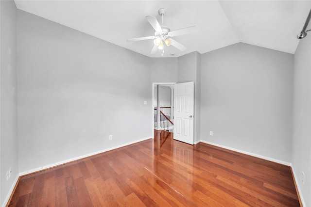 21142 Granite Trail Ln, Richmond, TX 77407 - unfurnished bedroom with lofted ceiling, wood finished floors, and a ceiling fan