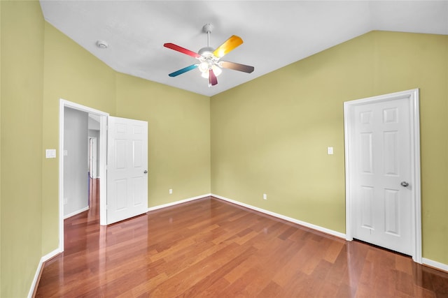 21142 Granite Trail Ln, Richmond, TX 77407 - unfurnished bedroom featuring wood finished floors, vaulted ceiling, and ceiling fan